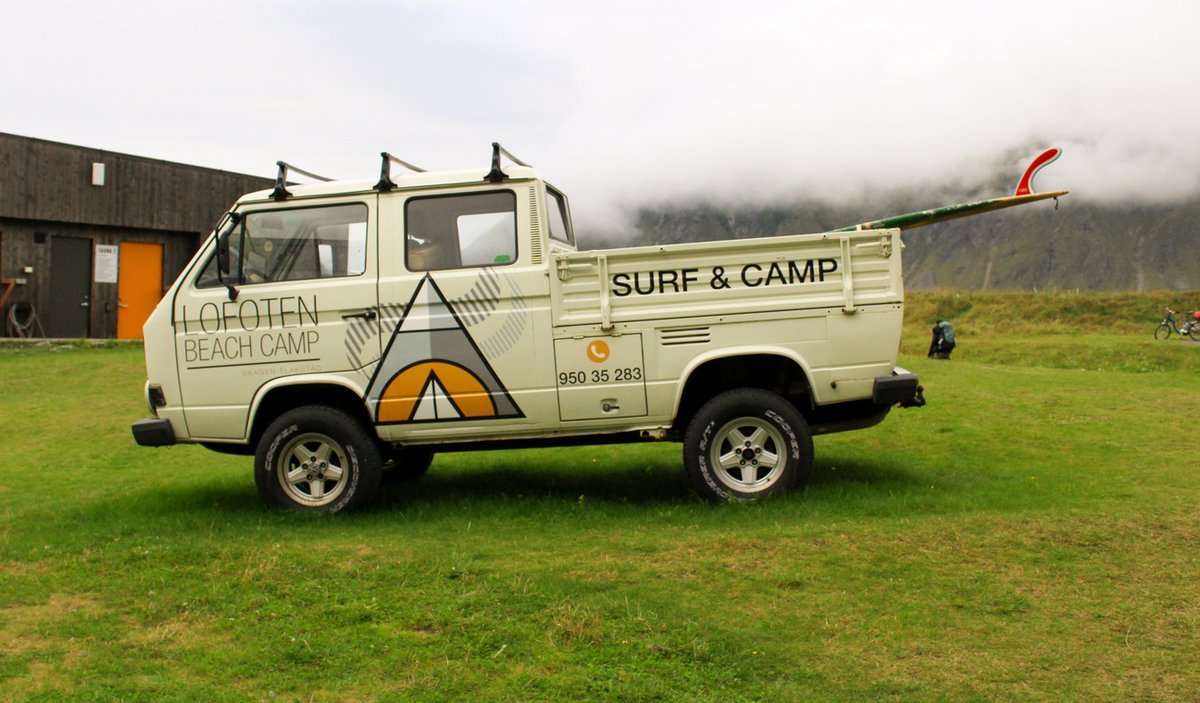 Lofoten Beach Camp surf and camp pick-up truck parked on the grass